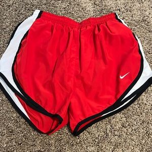 Red Nike shorts